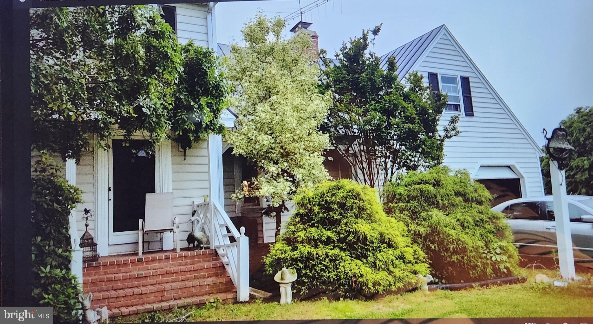 19255 Telegraph Springs Road Purcellville, VA 20132 - Photo 7 of 20 Charming home embraced by lush greenery.