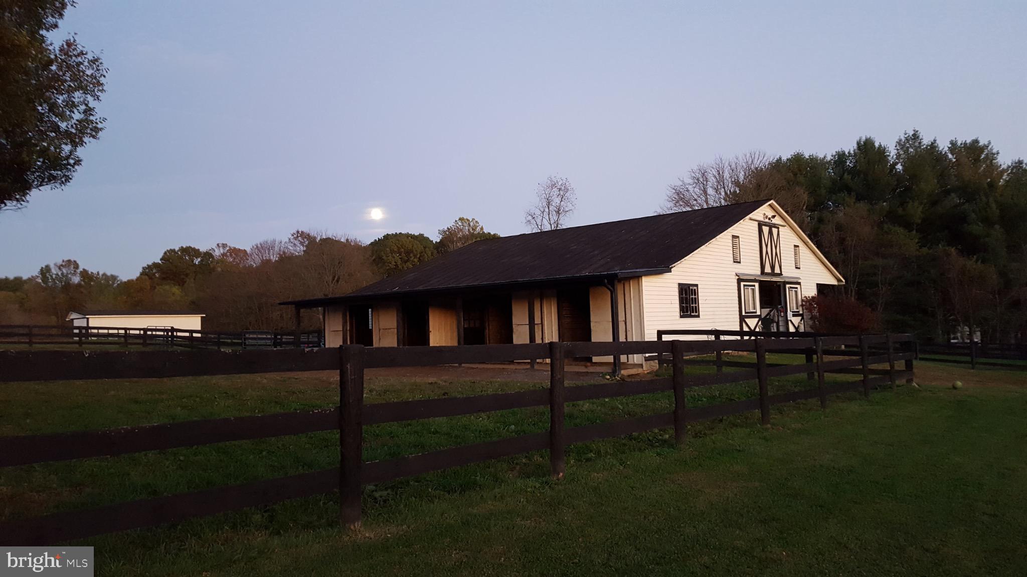 19255 Telegraph Springs Road Purcellville, VA 20132 - Photo 10 of 20 Charming barn under a twilight sky.