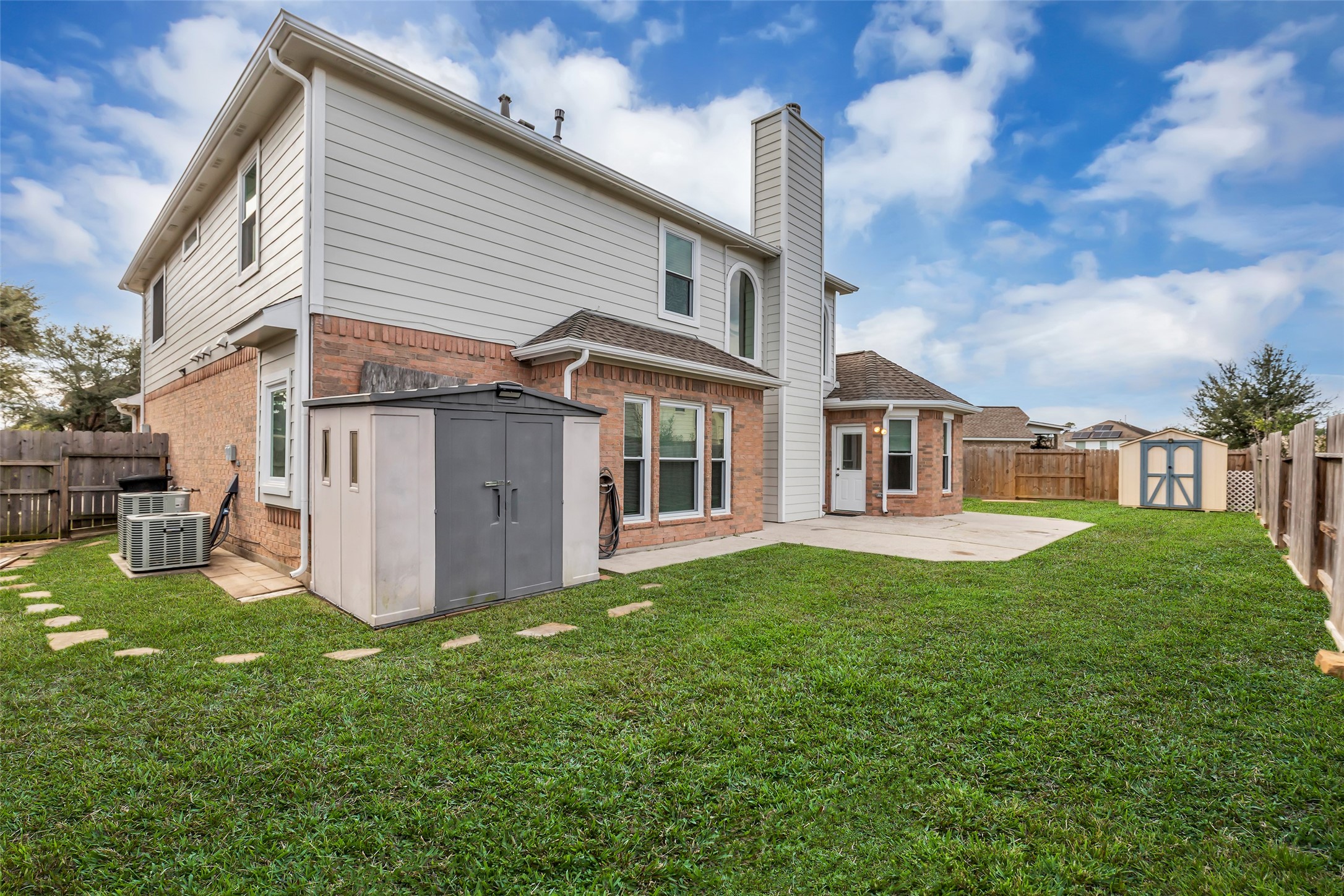 21618 Hannover Forest Spring, TX 77388 - Photo 32 of 32 Backyard with two storage sheds space for lawn equipment and outdoor storage.