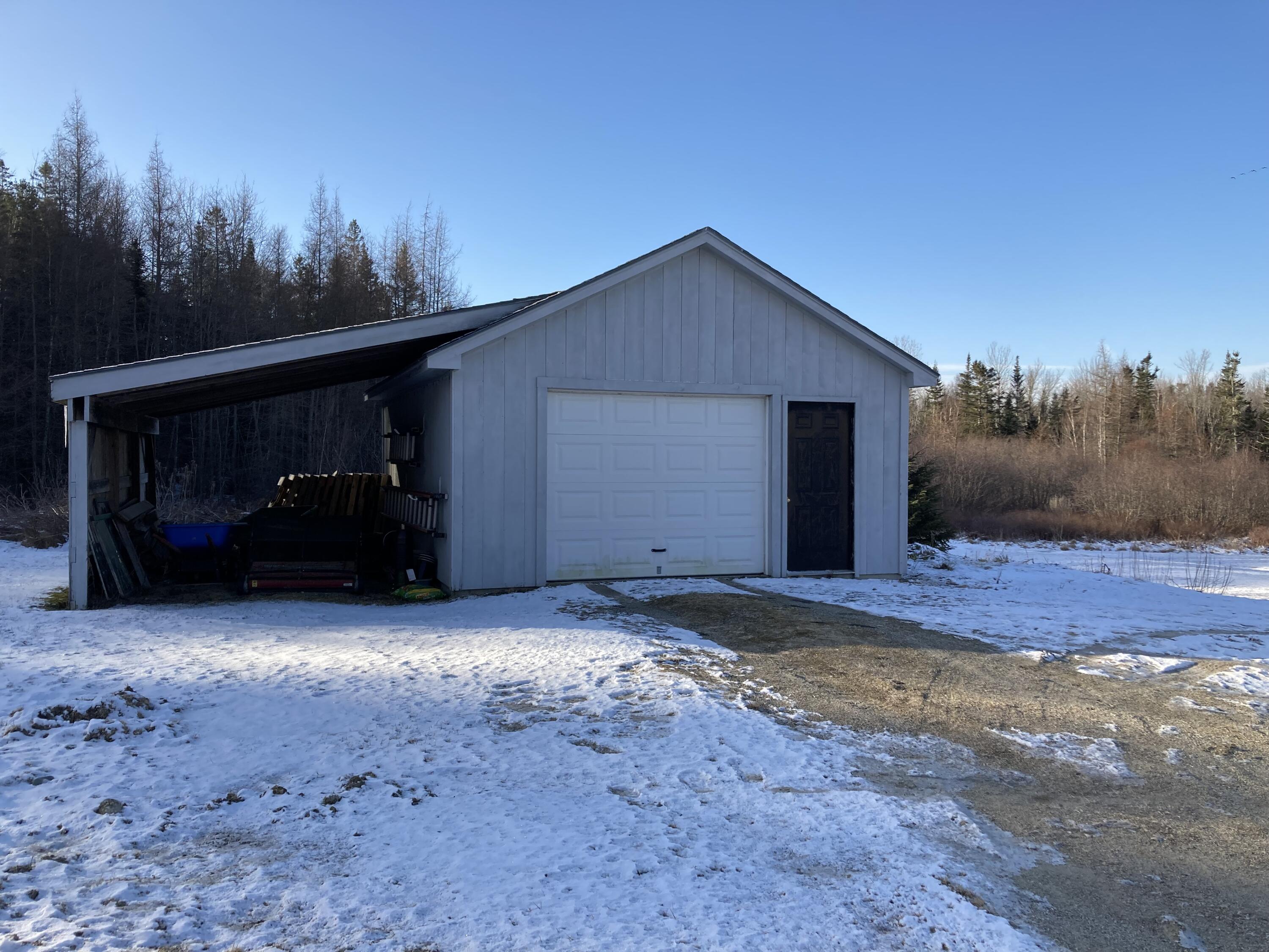 25 Donnell Pond Road Franklin, ME 04634 - Photo 34 of 34 One-car garage with shed area.