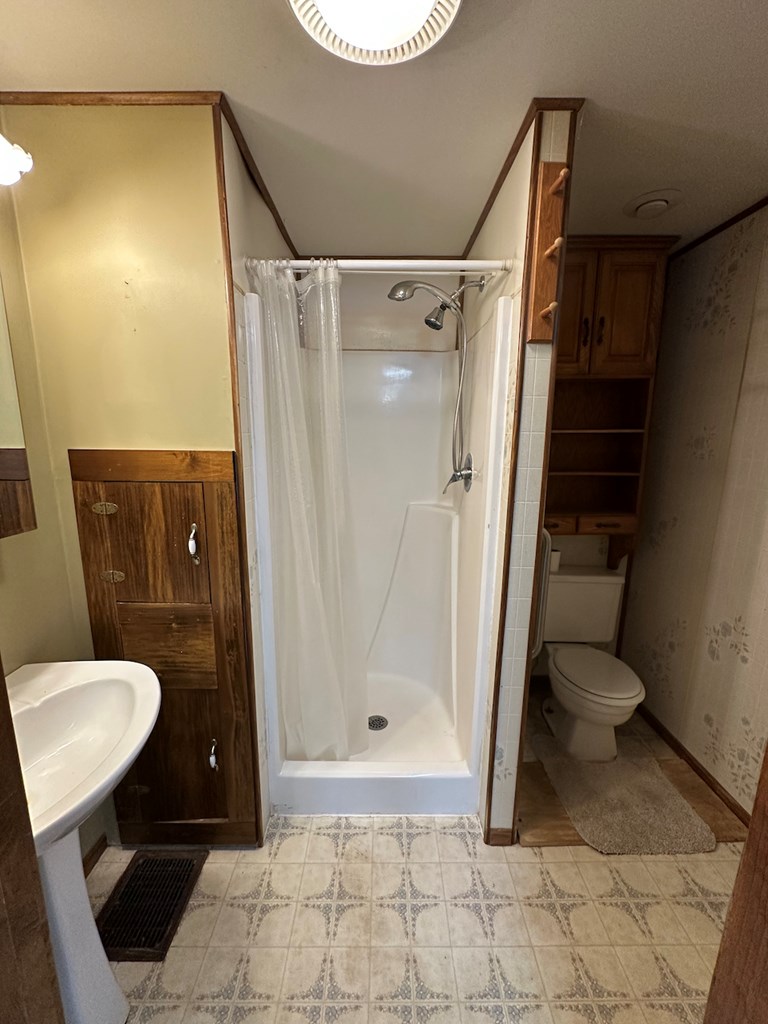 3776 Georgetown Road Polk, PA 16342 - Photo 14 of 26 a bathroom with a sink and a toilet