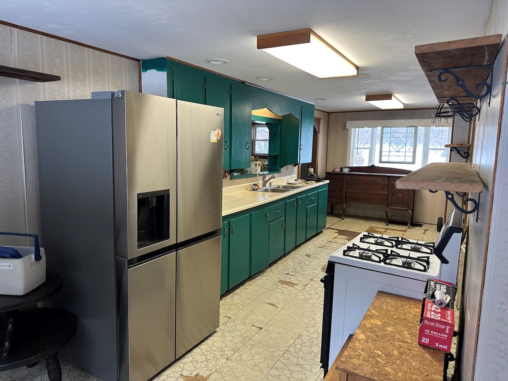 3776 Georgetown Road Polk, PA 16342 - Photo 15 of 26 a kitchen with sink refrigerator and window