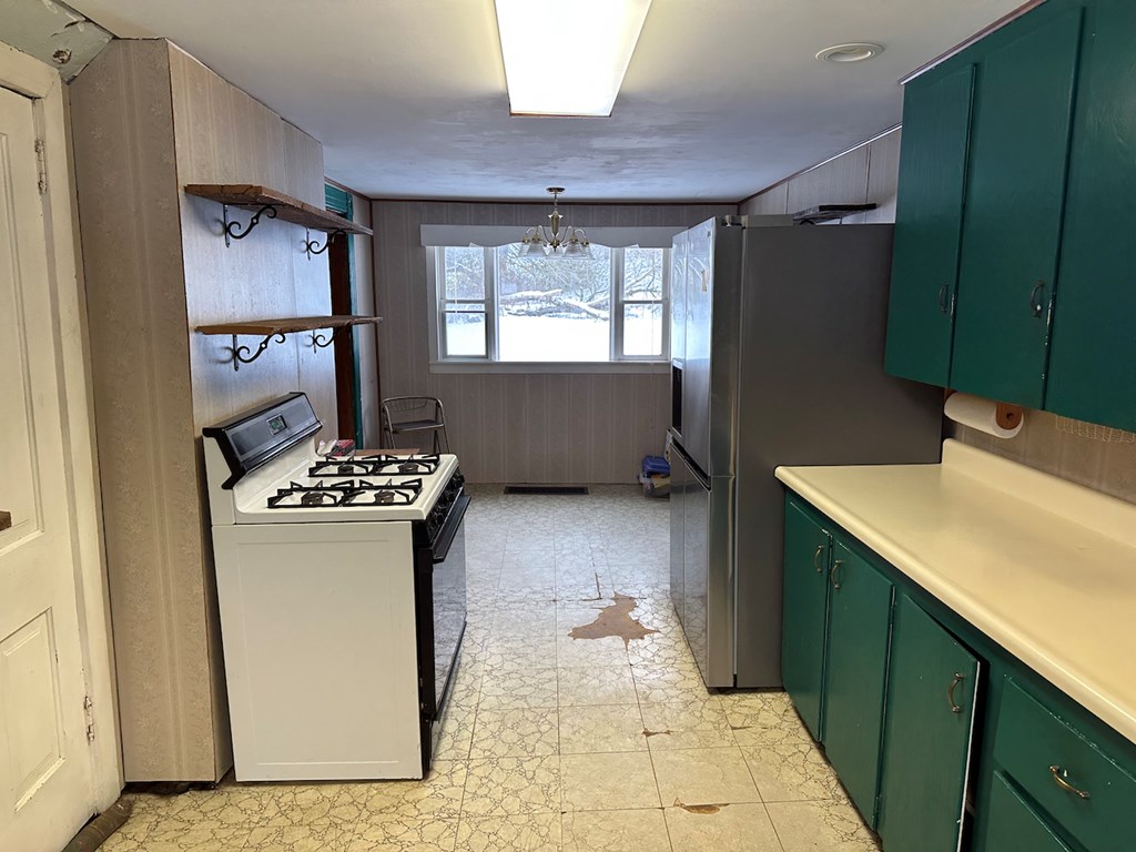 3776 Georgetown Road Polk, PA 16342 - Photo 18 of 26 a kitchen with stainless steel appliances a refrigerator and a stove top oven