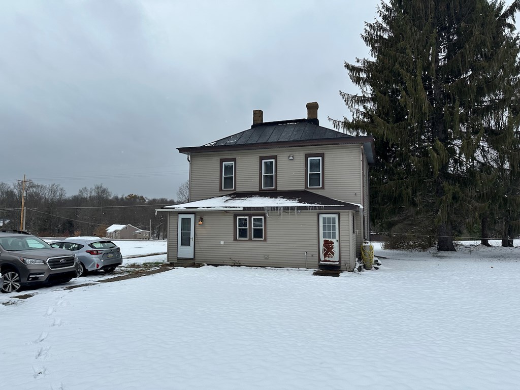 3776 Georgetown Road Polk, PA 16342 - Photo 2 of 26 a car parked in front of house