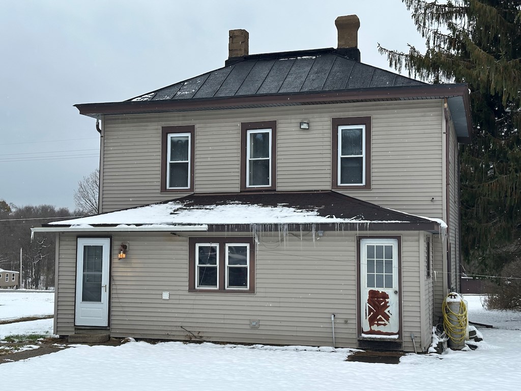 3776 Georgetown Road Polk, PA 16342 - Photo 3 of 26 a front view of a house with glass windows