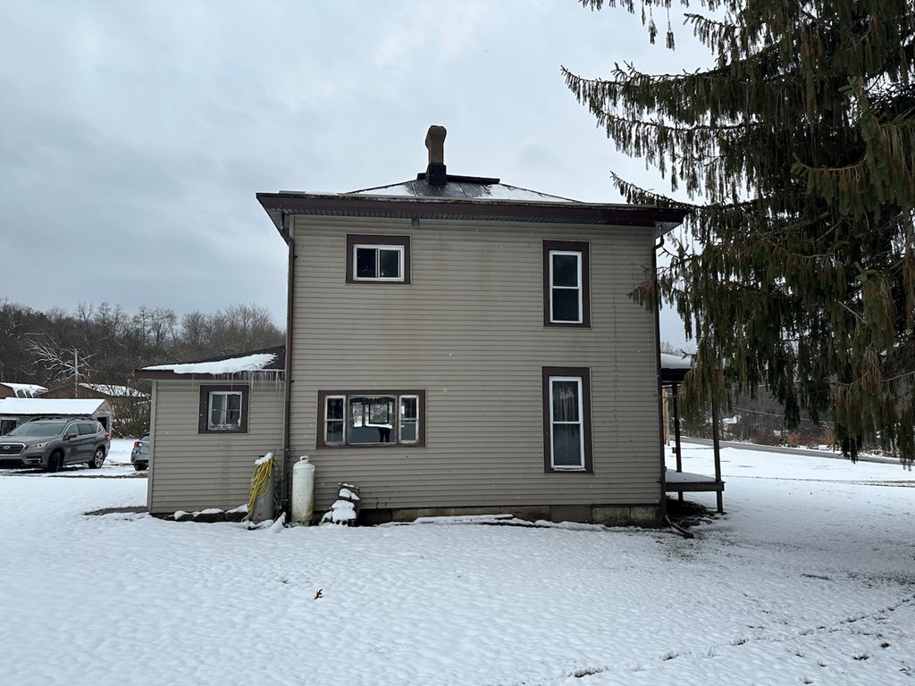 3776 Georgetown Road Polk, PA 16342 - Photo 4 of 26 a view of a house with a snow in the background