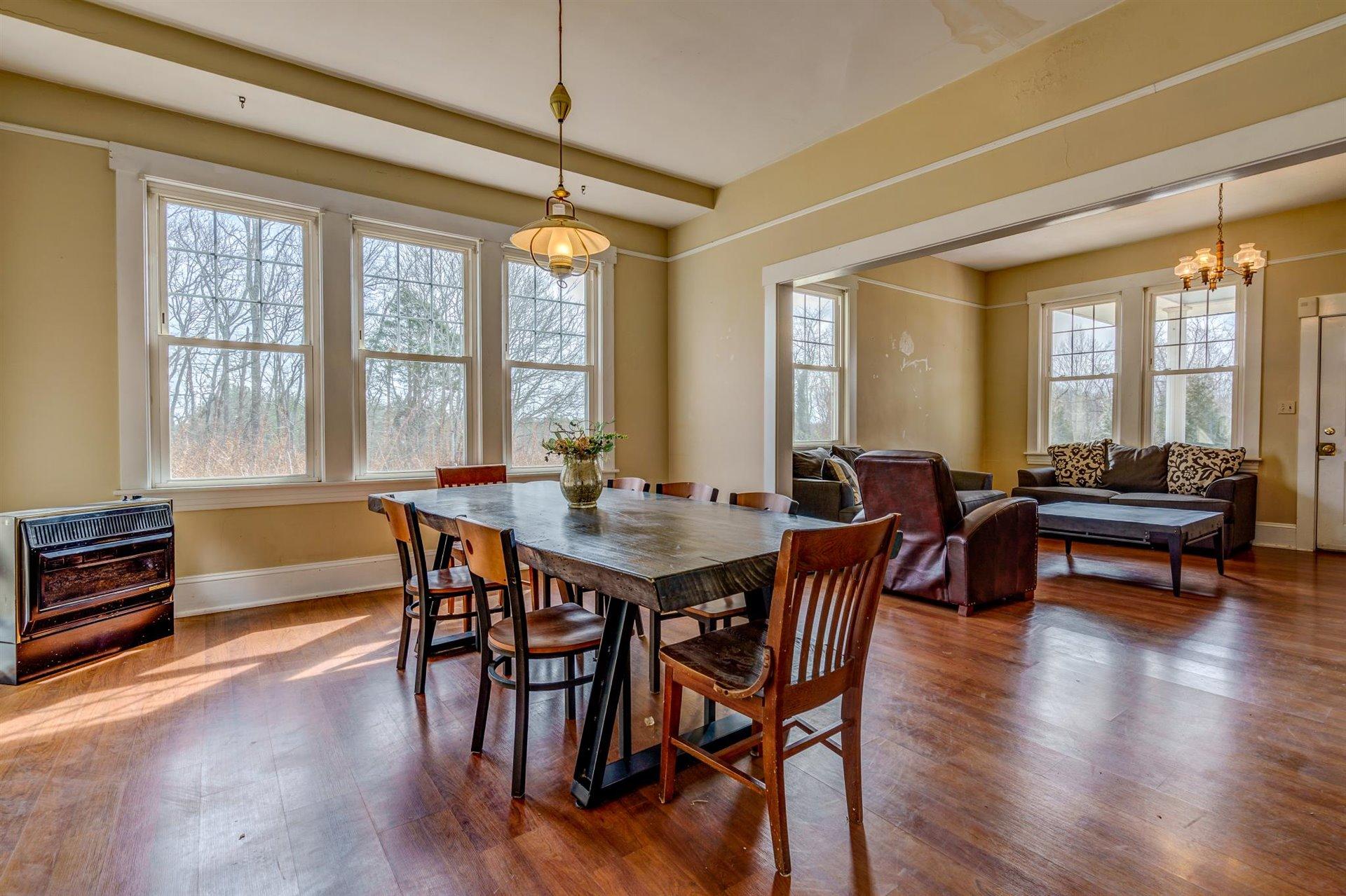 185 Tabernacle Road Penhook, VA 24137 - Photo 11 of 37 a view of a dining room with furniture window and wooden floor