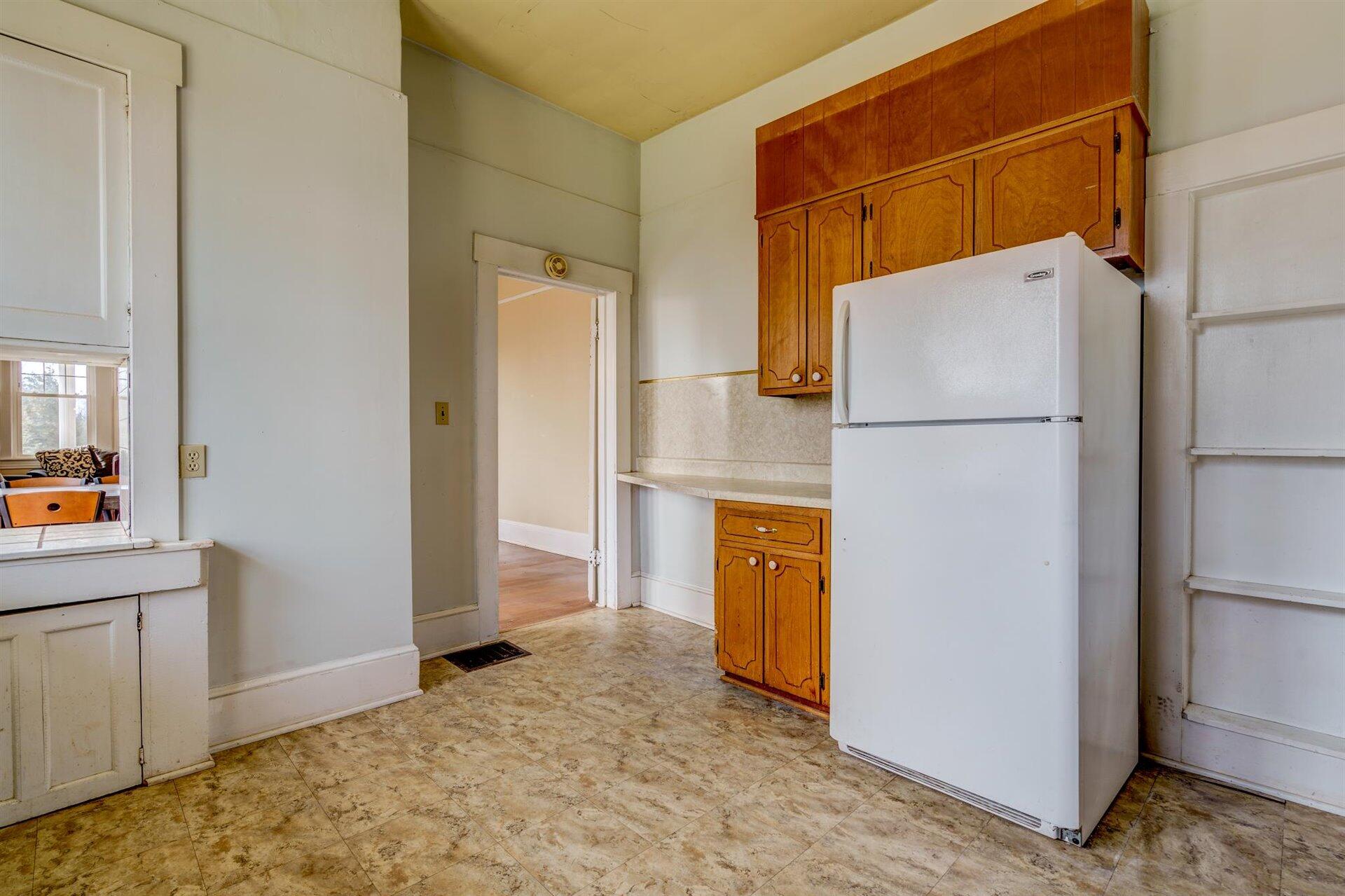 185 Tabernacle Road Penhook, VA 24137 - Photo 14 of 37 a view of kitchen with cabinets and refrigerator