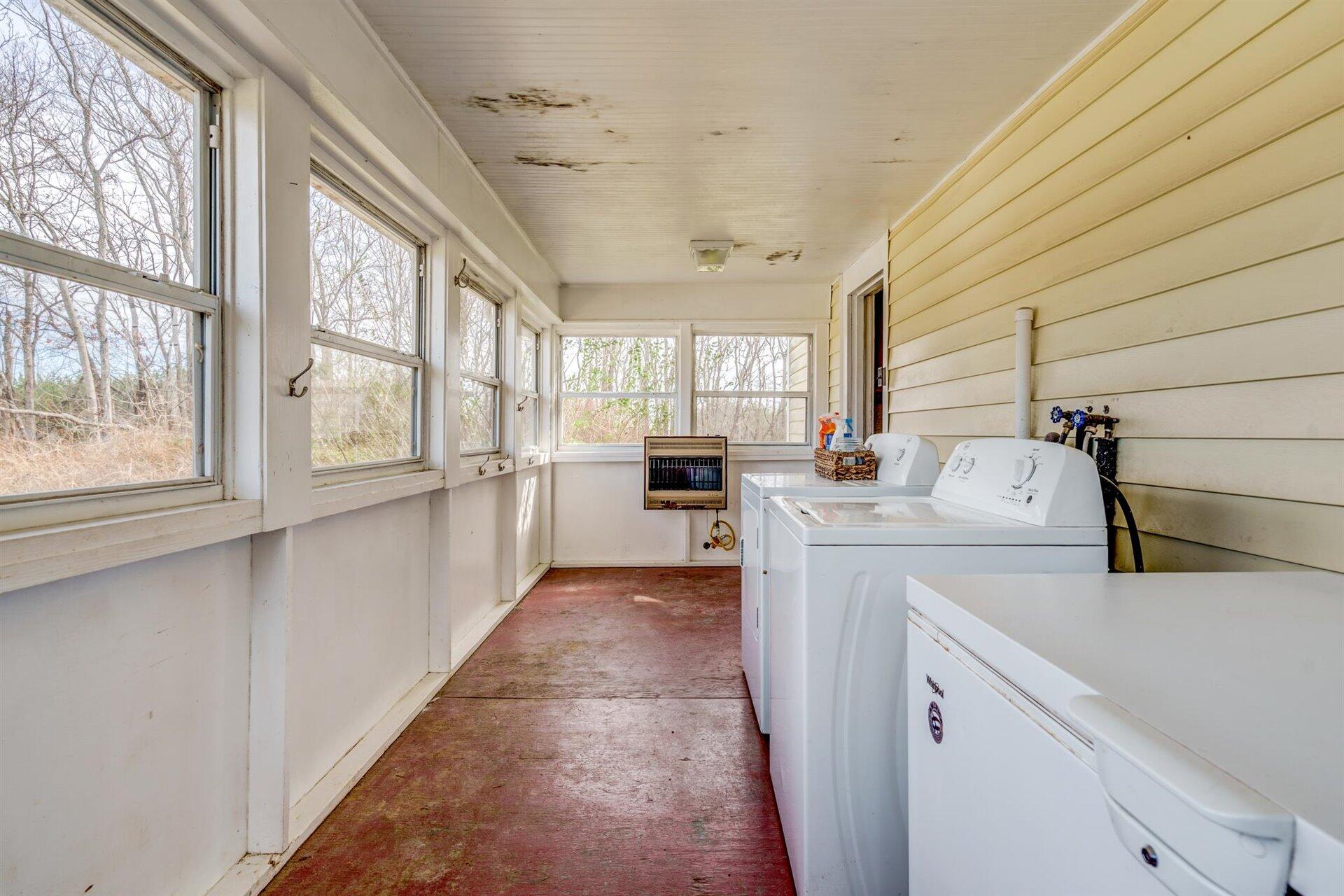 185 Tabernacle Road Penhook, VA 24137 - Photo 15 of 37 a kitchen with a sink cabinets stainless steel appliances and a large window