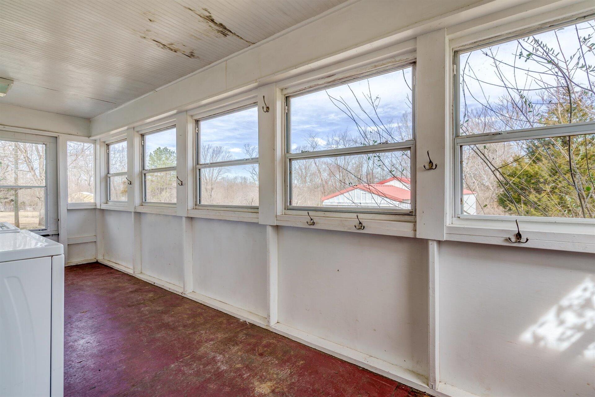 185 Tabernacle Road Penhook, VA 24137 - Photo 16 of 37 wooden floor in an empty room with large window