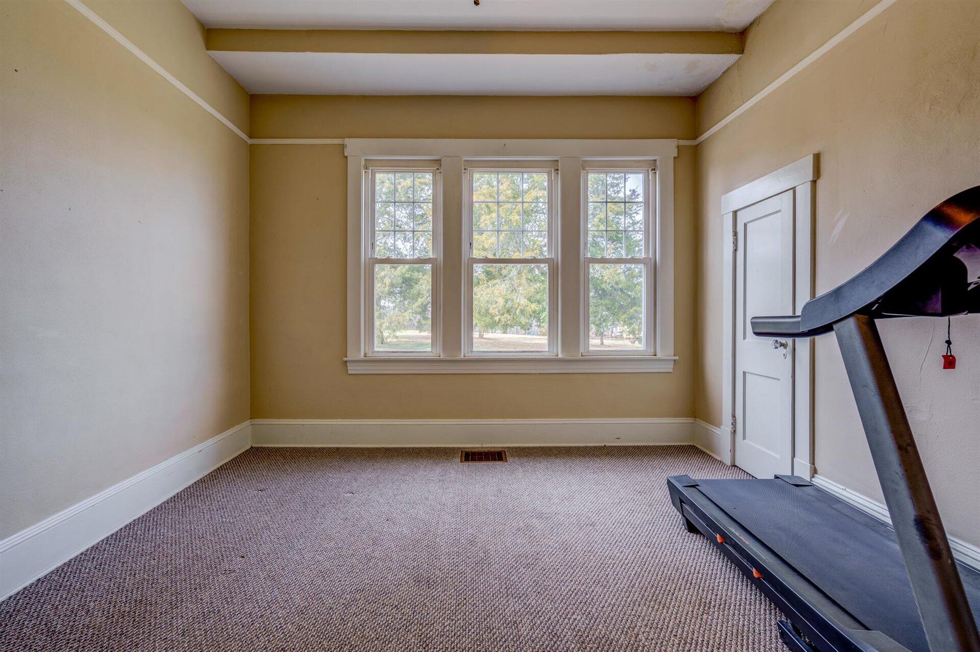 185 Tabernacle Road Penhook, VA 24137 - Photo 19 of 37 a view of room with window and stairs