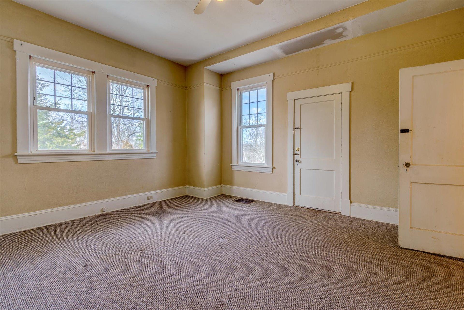 185 Tabernacle Road Penhook, VA 24137 - Photo 20 of 37 an empty room with windows