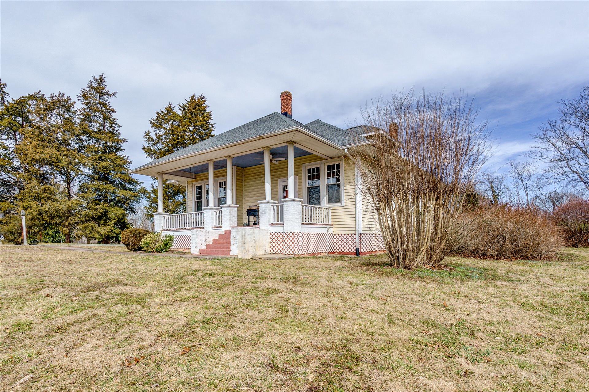 185 Tabernacle Road Penhook, VA 24137 - Photo 3 of 37 a front view of a house with a yard