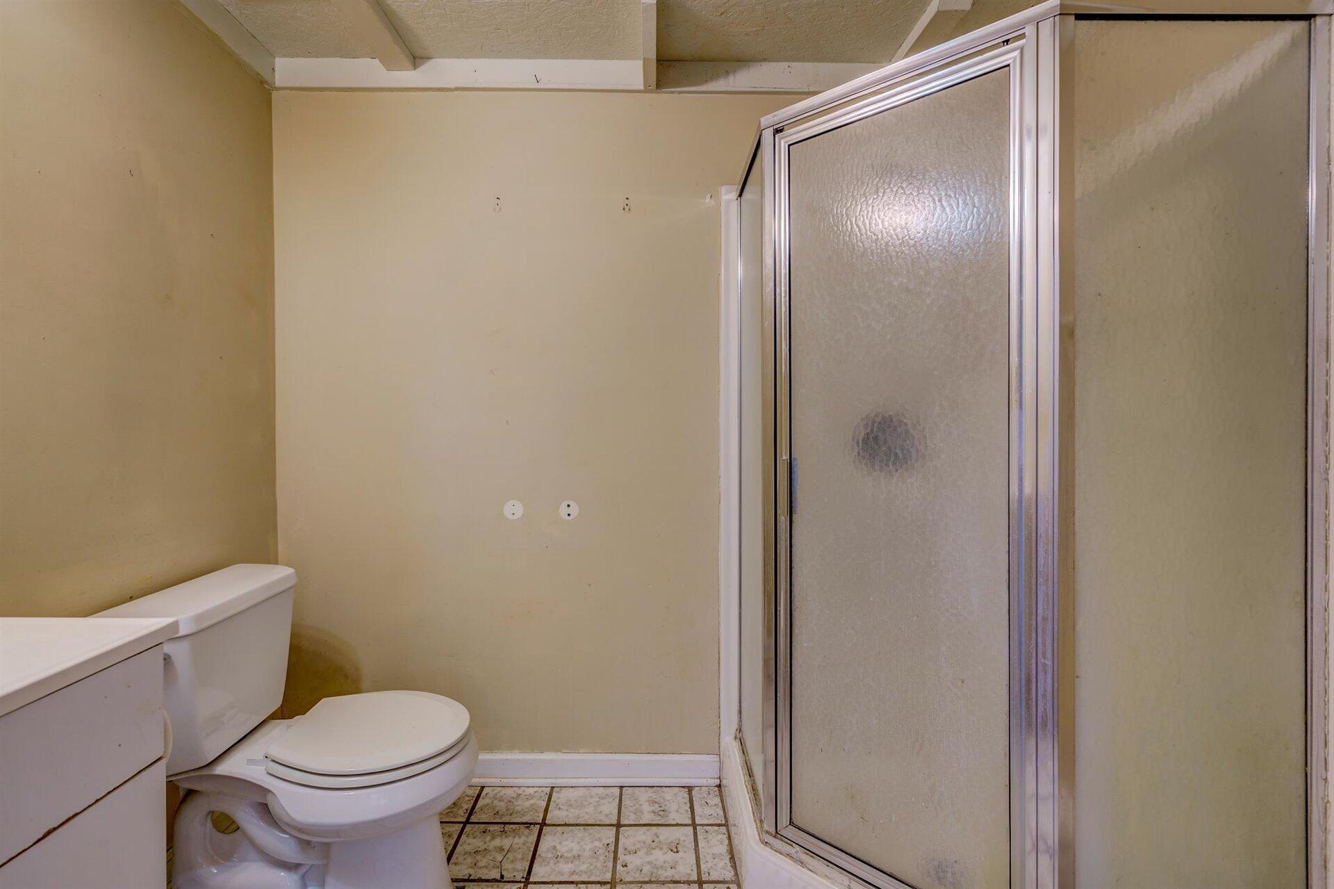 185 Tabernacle Road Penhook, VA 24137 - Photo 23 of 37 a white toilet sitting next to a bathroom sink
