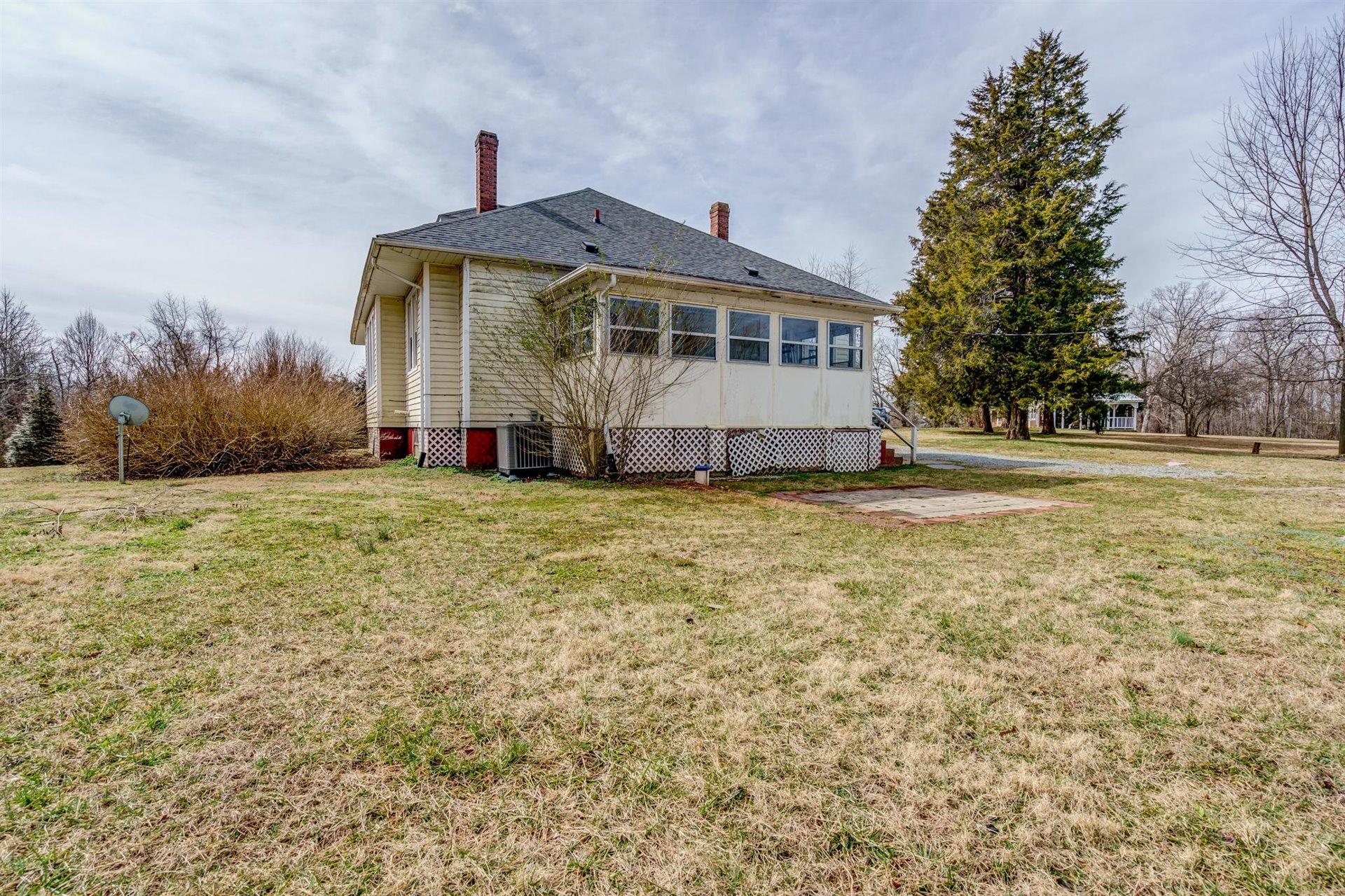 185 Tabernacle Road Penhook, VA 24137 - Photo 32 of 37 a front view of a house with a yard