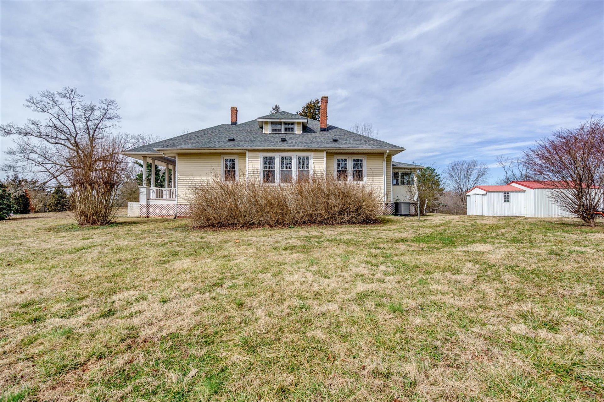 185 Tabernacle Road Penhook, VA 24137 - Photo 33 of 37 a front view of a house with a yard