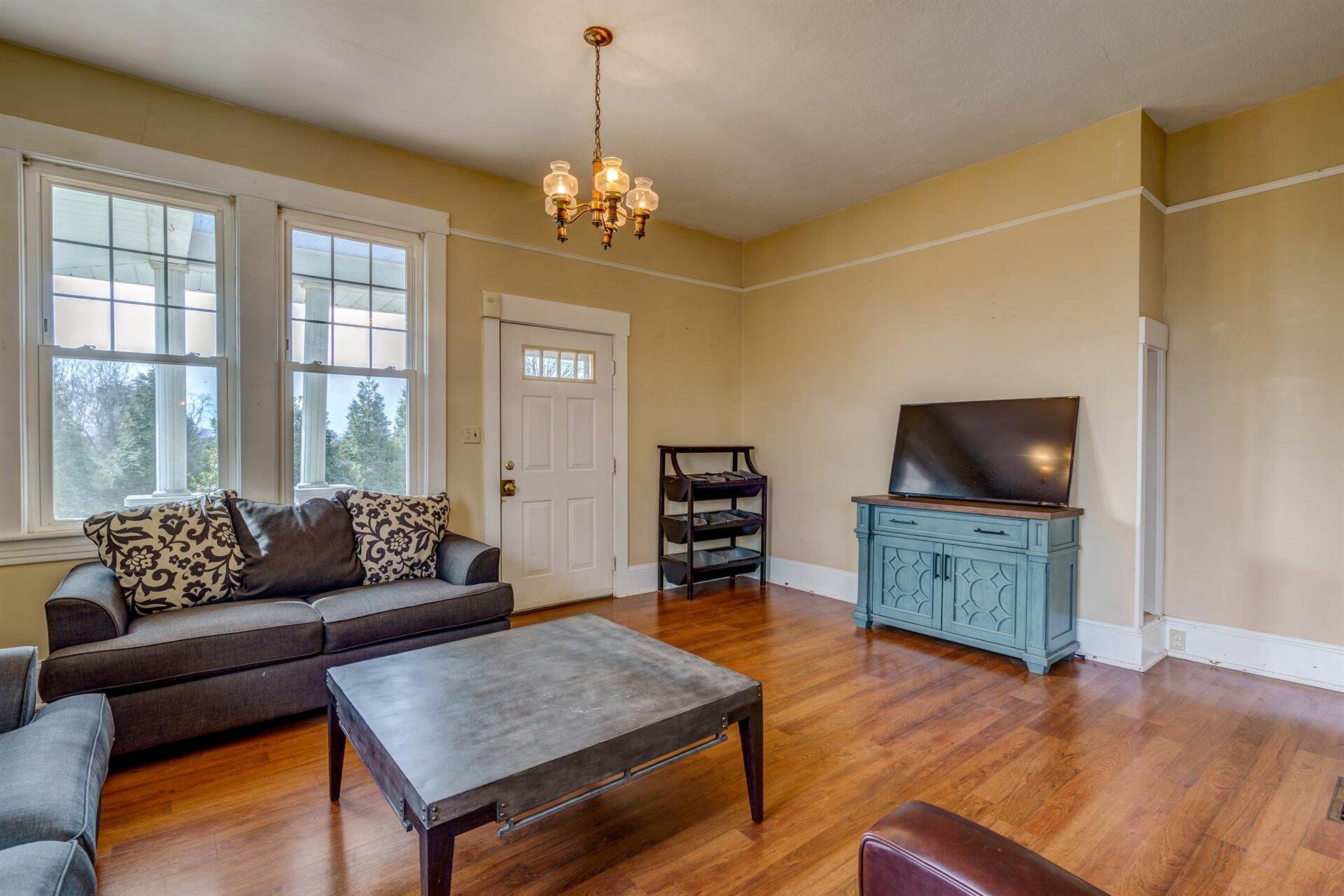 185 Tabernacle Road Penhook, VA 24137 - Photo 7 of 37 a living room with furniture and a flat screen tv