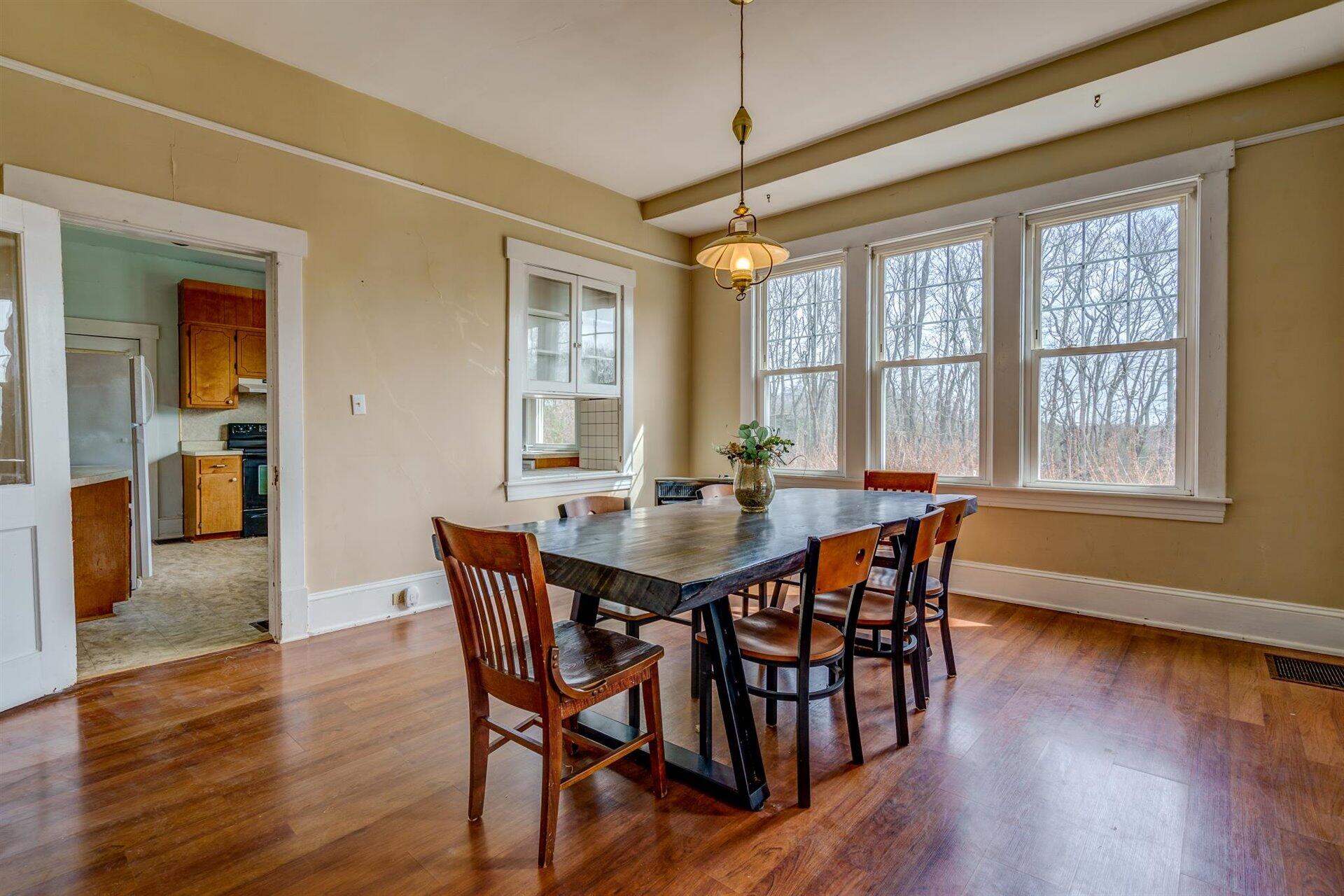 185 Tabernacle Road Penhook, VA 24137 - Photo 10 of 37 a dining room with furniture window wooden floor