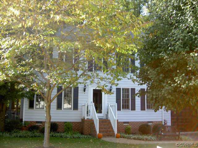 5310 Chestnut Bluff Road Midlothian, VA 23112 - Photo 1 of 1 a front view of a house with a yard
