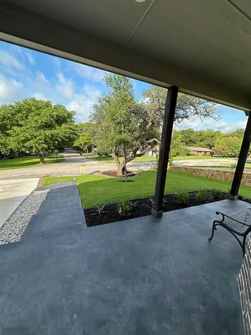 a view of swimming pool with a yard