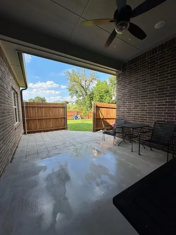 a view of back yard with furniture