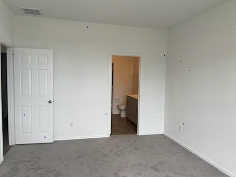 1509 Hope Rnch Road Leander, TX 78641 - Photo 13 of 25 Unfurnished bedroom featuring carpet, baseboards, and ensuite bath