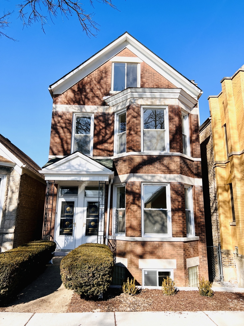 a view of a white building among the street