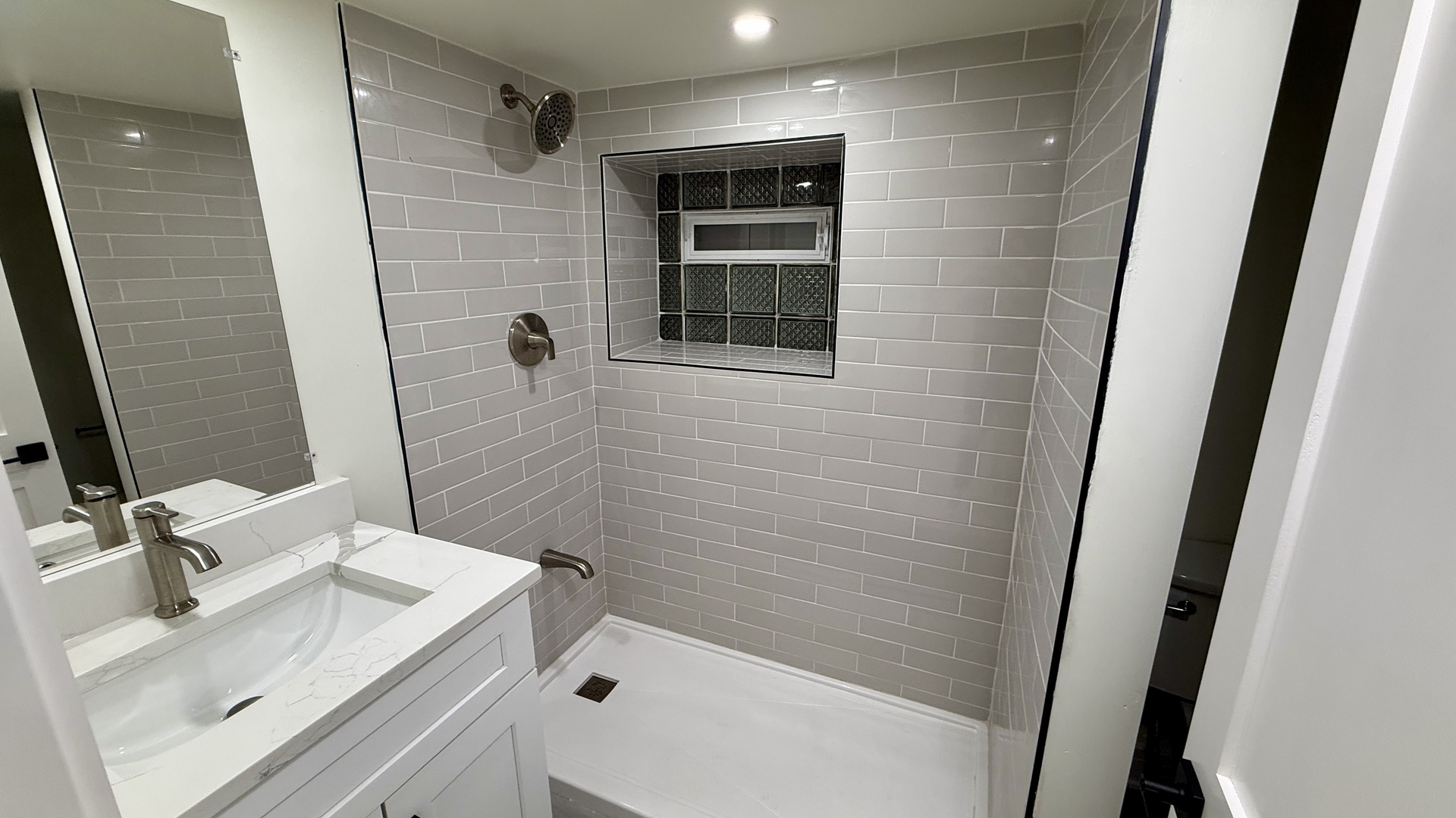 1906 West 34th Place, Unit G Chicago, IL 60608 - Photo 7 of 10 a bathroom with a sink and a mirror