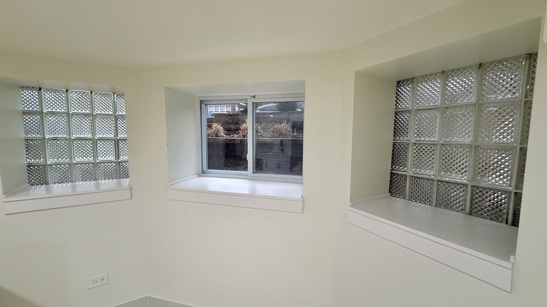 1906 West 34th Place, Unit G Chicago, IL 60608 - Photo 9 of 10 a view of an empty room with a window