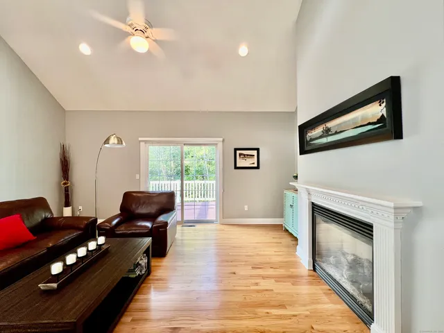 a living room with furniture fireplace and flat screen tv
