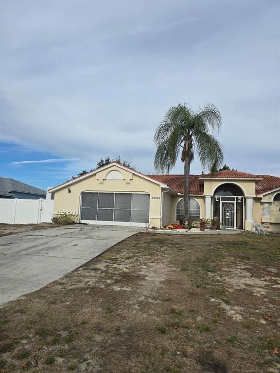 13055 Santee Street Spring Hill, FL 34609 - Photo 3 of 15 a front view of a house with a yard