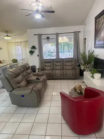 a living room with furniture and a window