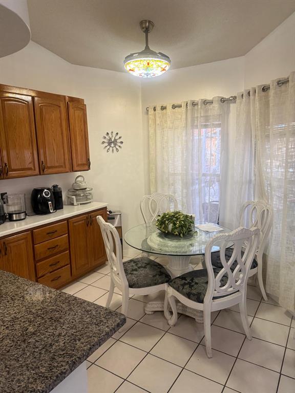 13055 Santee Street Spring Hill, FL 34609 - Photo 7 of 15 a table and chairs in a kitchen