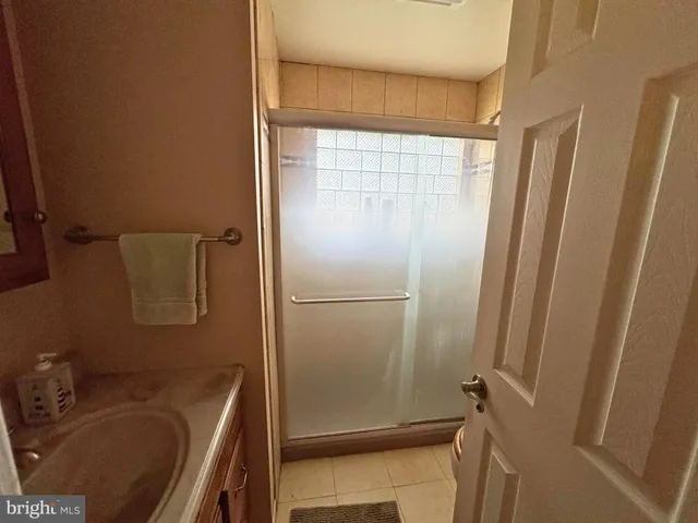 a bathroom with a tub and a sink