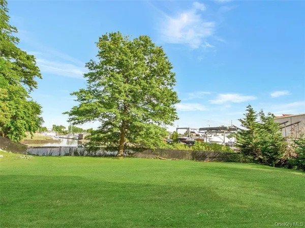 a view of a lake with houses in the back