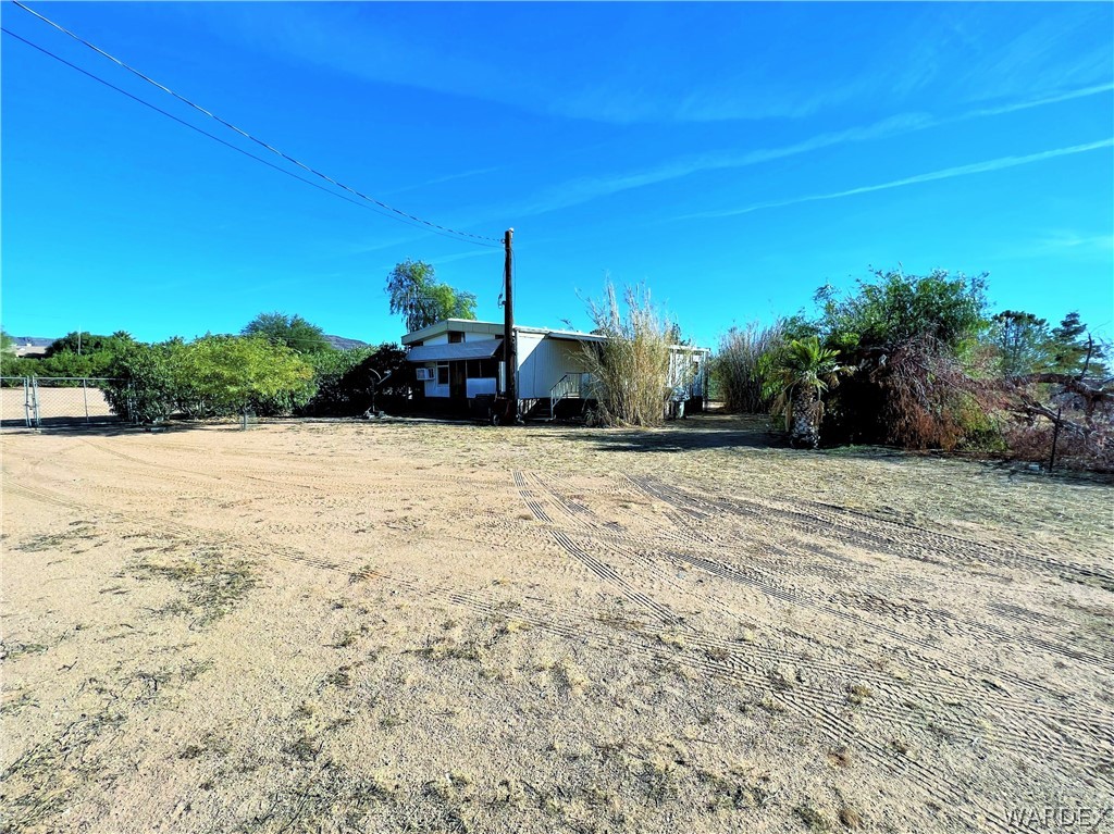 171 South Houck Road Golden Valley, AZ 86413 - Photo 1 of 36 a front view of a house with a yard