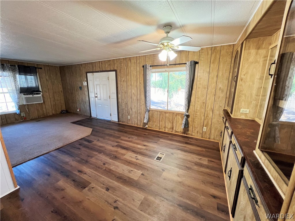 171 South Houck Road Golden Valley, AZ 86413 - Photo 6 of 36 a view of an empty room with wooden floor and a window