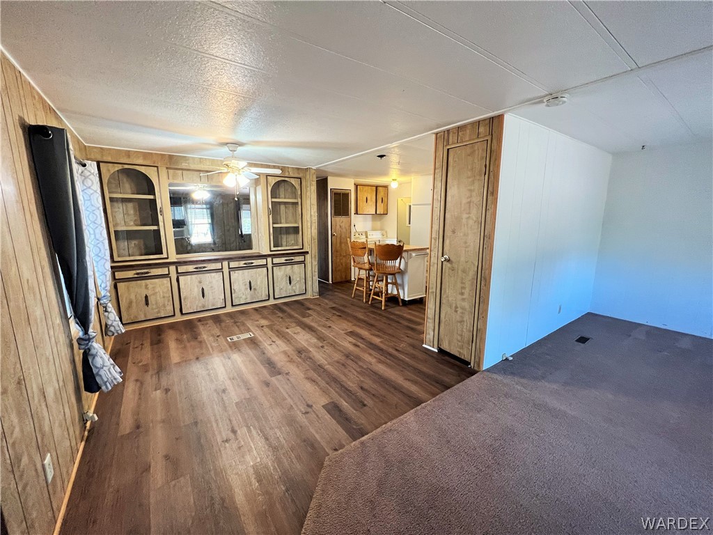 171 South Houck Road Golden Valley, AZ 86413 - Photo 9 of 36 a view of a livingroom with furniture hardwood floor and staircase