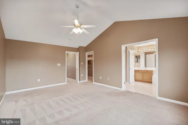 a view of an empty room with a bathroom