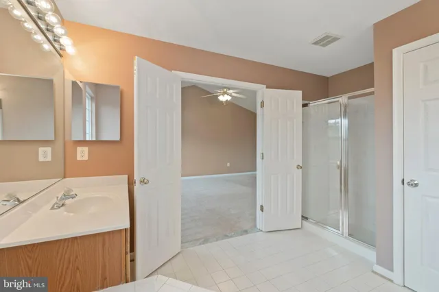 a bathroom with a bathtub and a sink