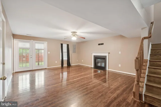 wooden floor in an empty room with a fireplace