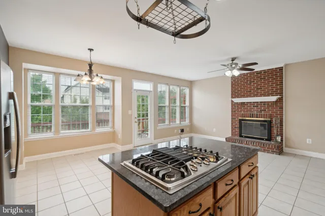 a kitchen with stove and cabinets