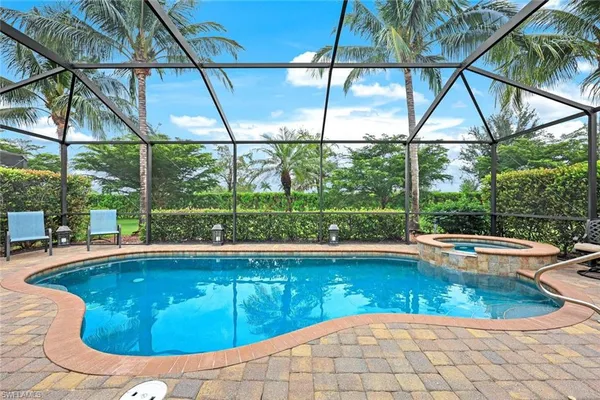 a view of a swimming pool with a porch