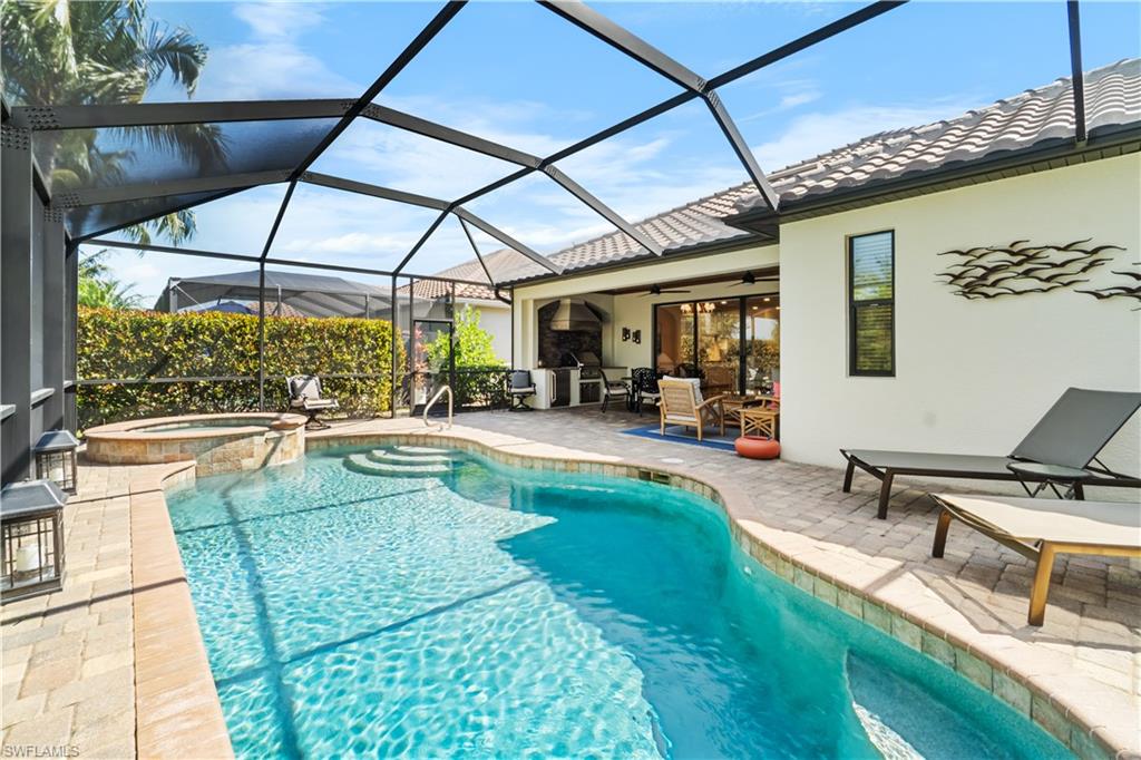 9419 Piacere Way Naples, FL 34113 - Photo 22 of 47 a view of swimming pool with outdoor seating