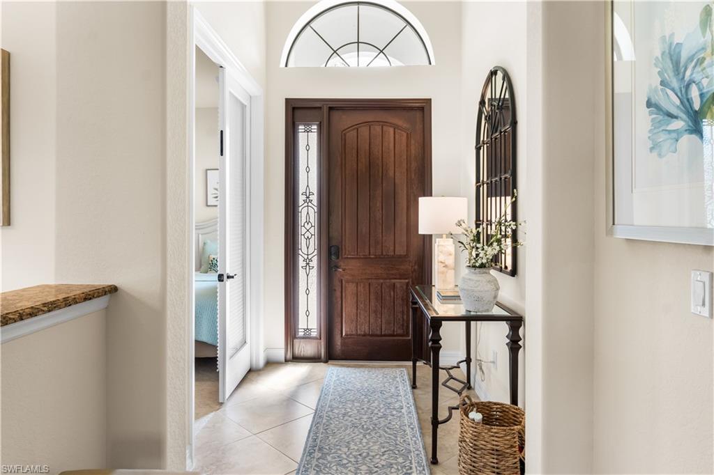 9419 Piacere Way Naples, FL 34113 - Photo 4 of 47 a view of front door with two mirror