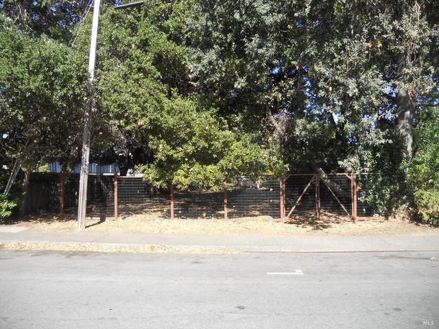 a view of house with snow on the road