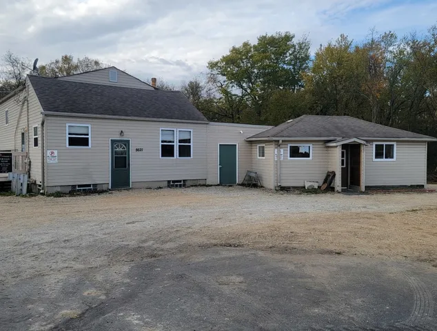 a house with trees in the background