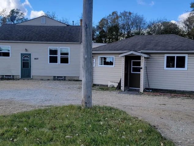 a view of a house with a yard