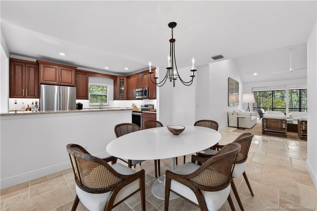 a view of a dining room with furniture window and outside view