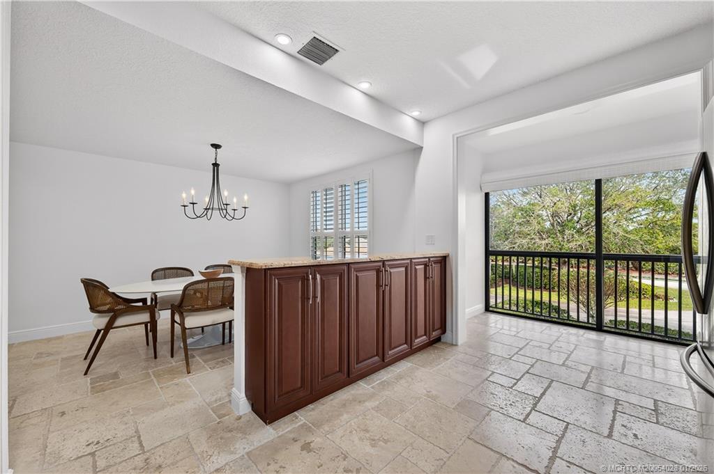 13204 Harbour Ridge Boulevard, Unit 2A Palm City, FL 34990 - Photo 13 of 38 a view of a dining room with furniture window and outside view